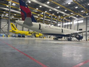 A commercial airplane in a maintenance hangar undergoing inspection or repair has been spotlighted in trade publications for projects honored.