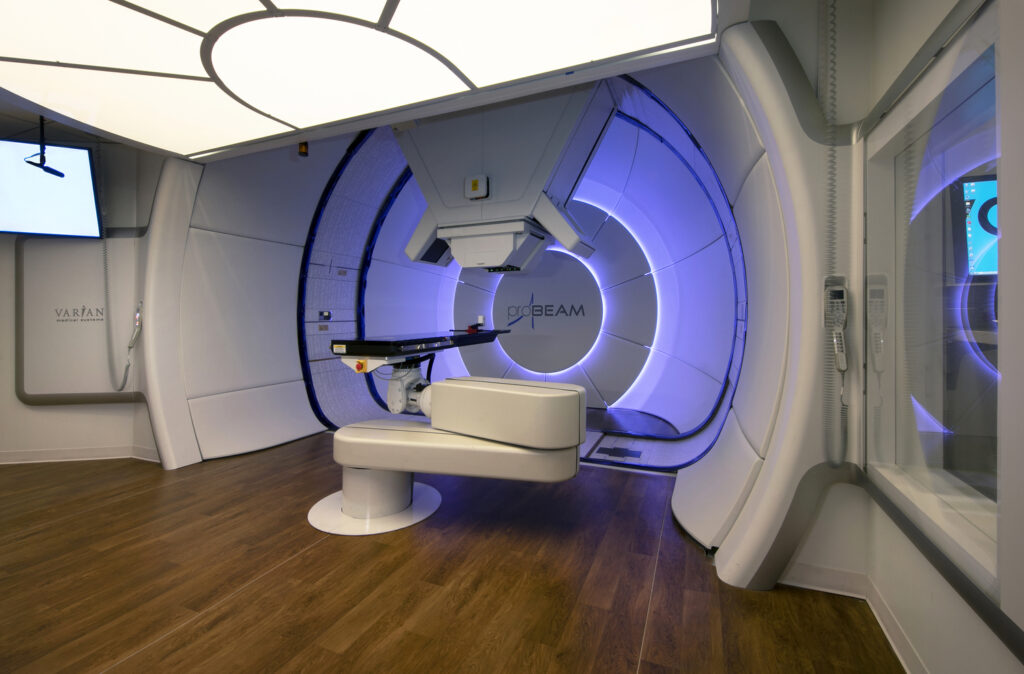 A modern radiotherapy treatment room with an advanced linear accelerator machine, recognized by the National Awards from Associated Builders and Contractors.