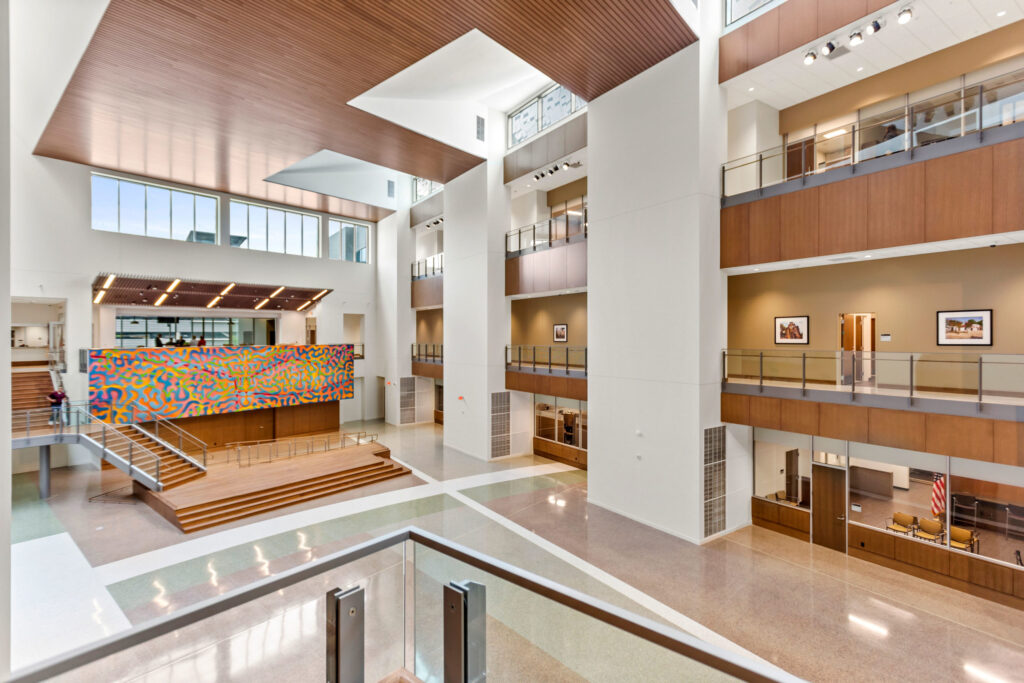 Spacious modern atrium with geometric architectural features and colorful art installation, showcased in ENR's four projects honored.