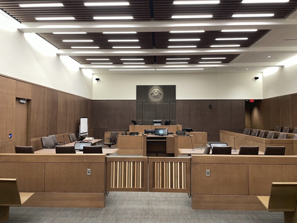 A modern courtroom interior with a judge's bench, witness stand, and jury box, awaiting participants, featured in ENR's Projects Honored.