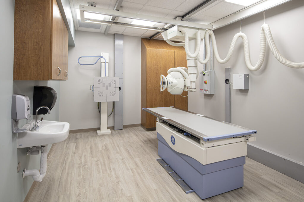 An empty x-ray room, converted into a space with modern medical imaging equipment.