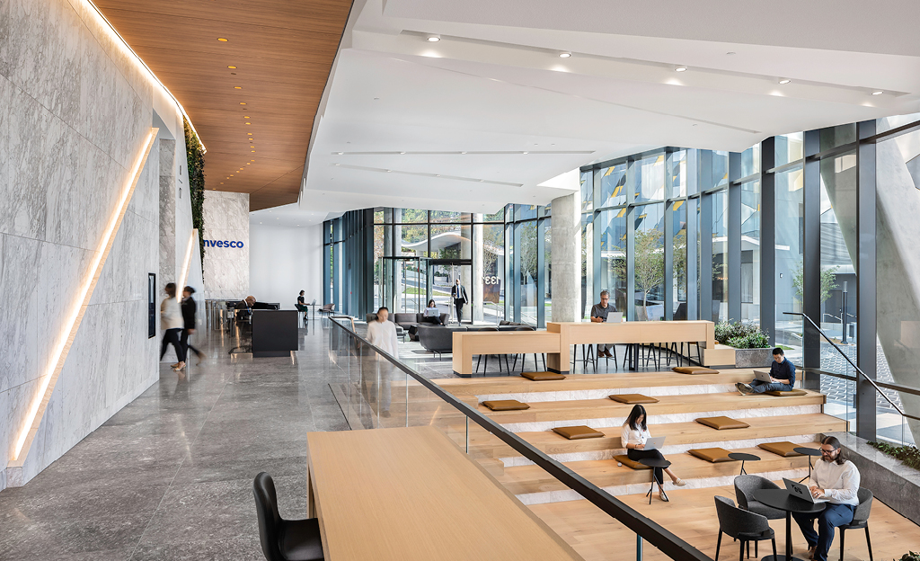 Modern office lobby in Midtown Union, Atlanta, with people and seating areas, opens to the public.