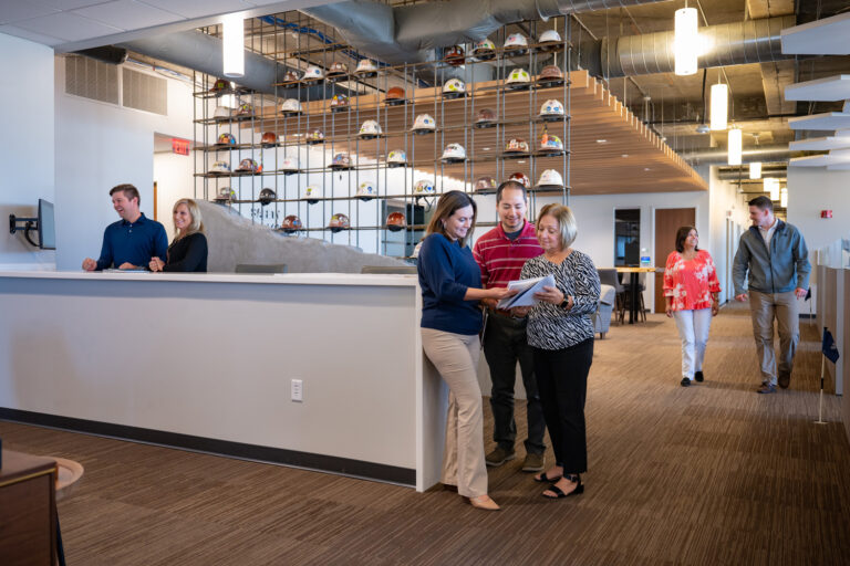 Professionals collaborating and engaging in various activities in a modern office environment in Orlando, Florida.