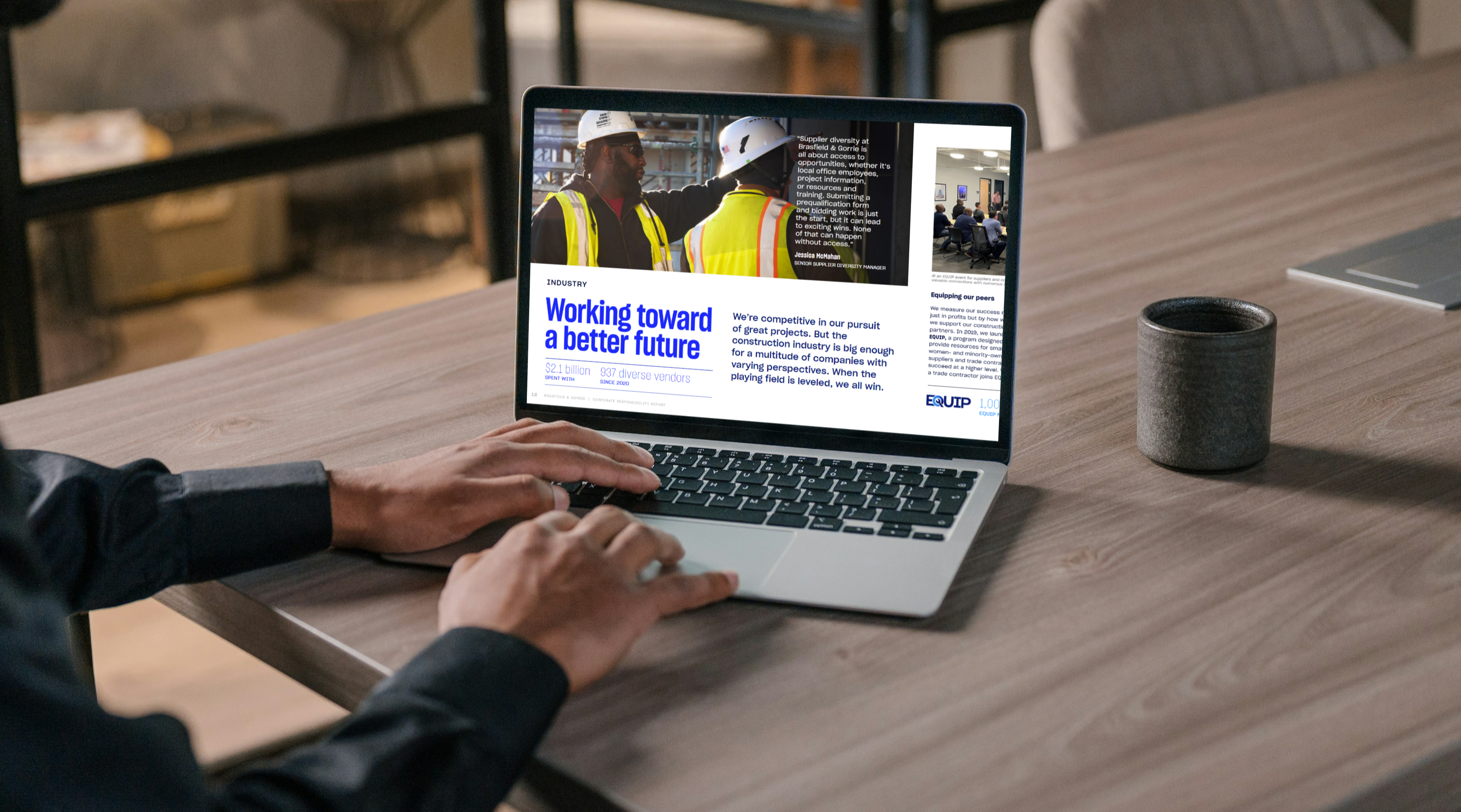 Person using a laptop displaying a webpage about construction workers with the headline 